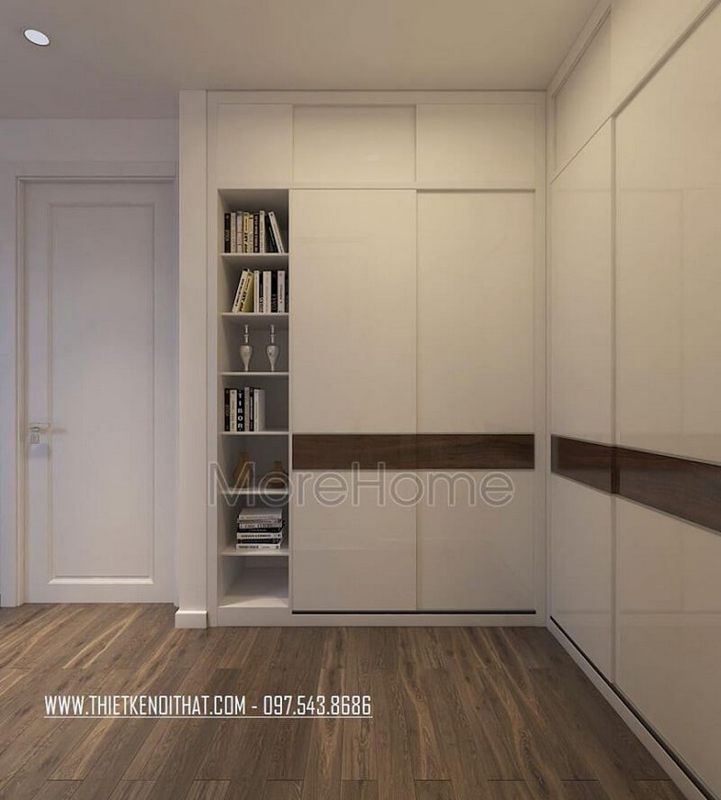 Sự hòa trộn màu sắc giữa tủ quần áo đẹp màu trắng với bức tường đồng màu mang lại một ảo giác liền mạch rất thú vị.